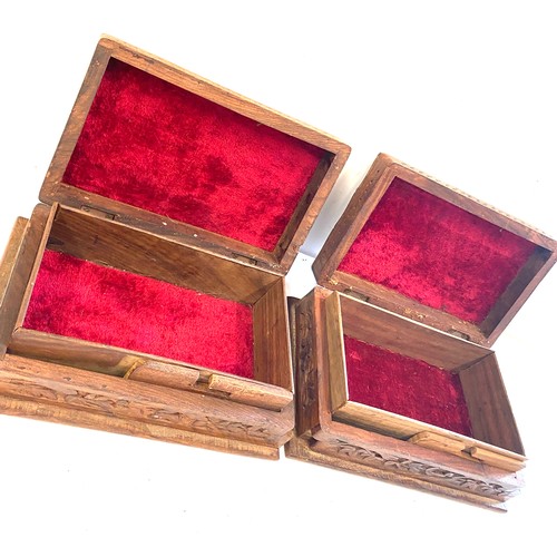 142 - Pair of vintage wooden carved cigarette boxes, each measures approx 3 inches tall 8 inches wide