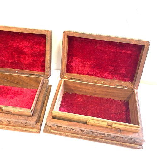 142 - Pair of vintage wooden carved cigarette boxes, each measures approx 3 inches tall 8 inches wide