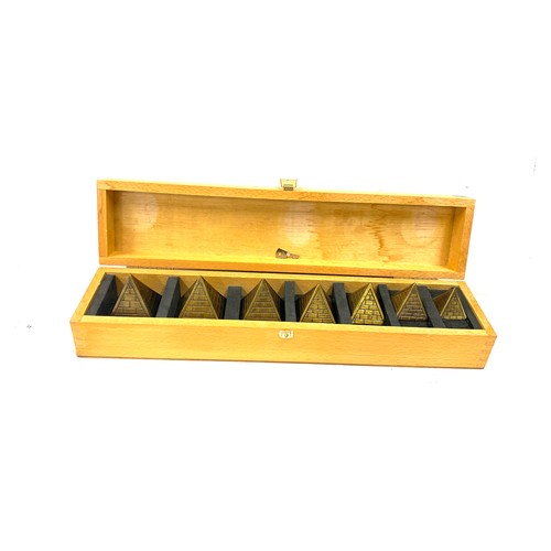 94 - Cased set of Brass Pyramid paper weights