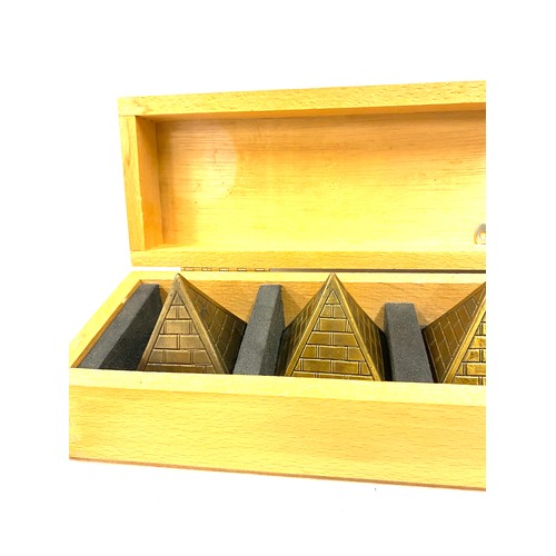 94 - Cased set of Brass Pyramid paper weights