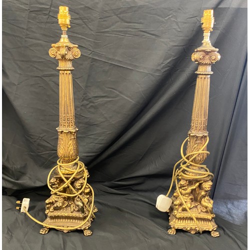 289 - Pair of ornate brass candle sticks, total height 25 inches