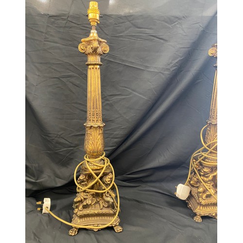 289 - Pair of ornate brass candle sticks, total height 25 inches