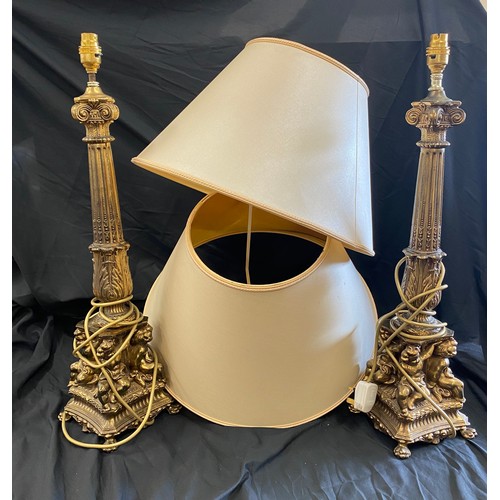 289 - Pair of ornate brass candle sticks, total height 25 inches