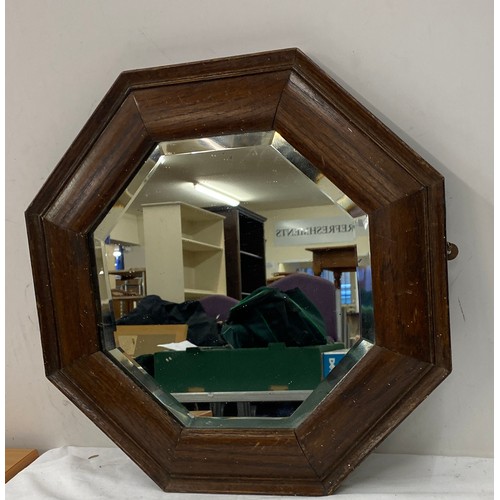 86 - Hexagonal wooden framed bevelled edge mirror measures approx 17inches by 17 inches