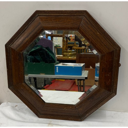 86 - Hexagonal wooden framed bevelled edge mirror measures approx 17inches by 17 inches