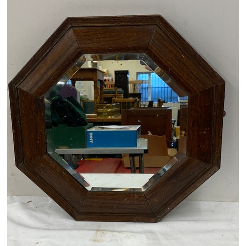 86 - Hexagonal wooden framed bevelled edge mirror measures approx 17inches by 17 inches