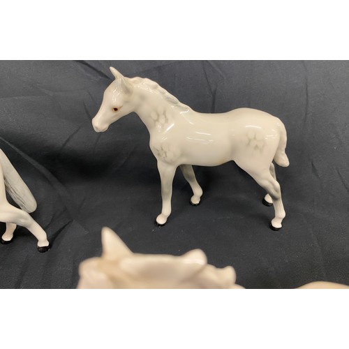 108 - Selection of 4 white Beswick horses