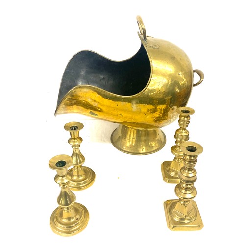 196 - Selection of brassware to include Helmet coal skuttle and  candlesticks