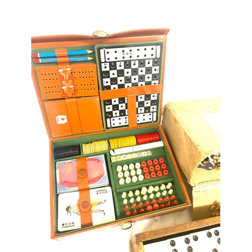 280 - A selection of vintage games to include a 1950s games compendium, a carved wooden chess piece set, d... 