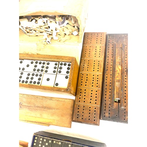 280 - A selection of vintage games to include a 1950s games compendium, a carved wooden chess piece set, d... 