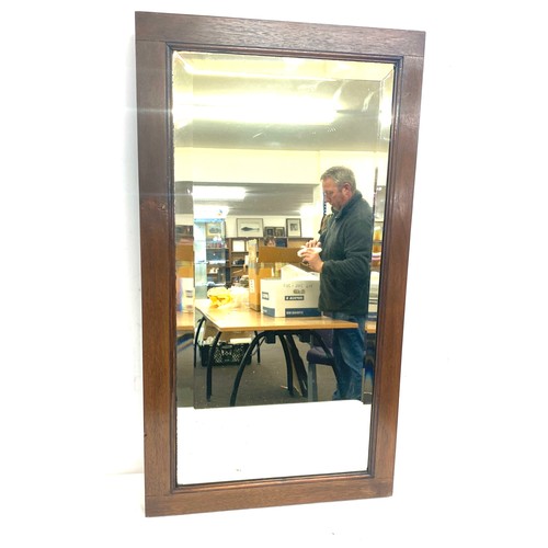 318 - Small solid oak framed mirror, approximate frame measurements: 25 x 15 inches