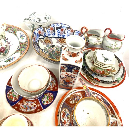 221 - Large selection of oriental pottery pieces to include plates, bowls, cups etc