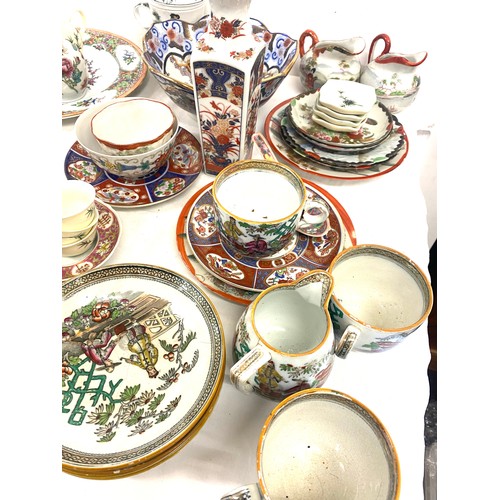 221 - Large selection of oriental pottery pieces to include plates, bowls, cups etc