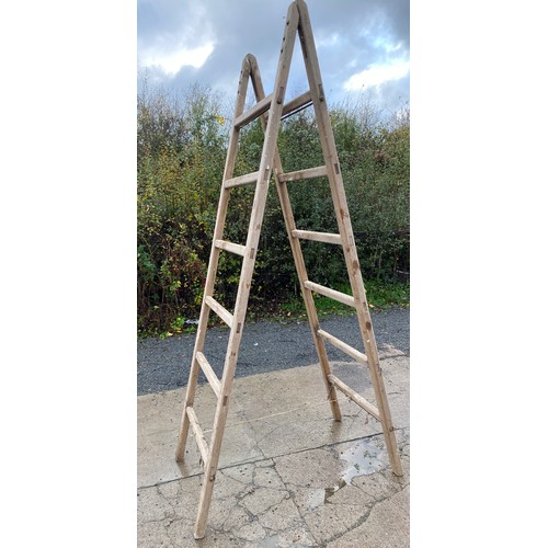 100S - Pair of vintage wooden over sized ladders height approx 106 inches tall