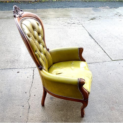 384 - Leather and mahogany nursing chair, button back