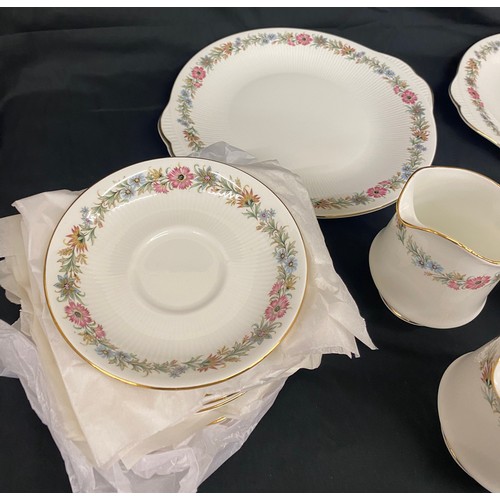 219 - Paragon Belinda tea set 6 setting to include 2 cake plates, milk jug, sugar bowl, 6 plates, cups and... 