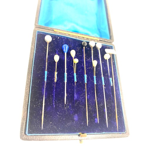 408 - Antique stick pin box with a selection of assorted stick pins