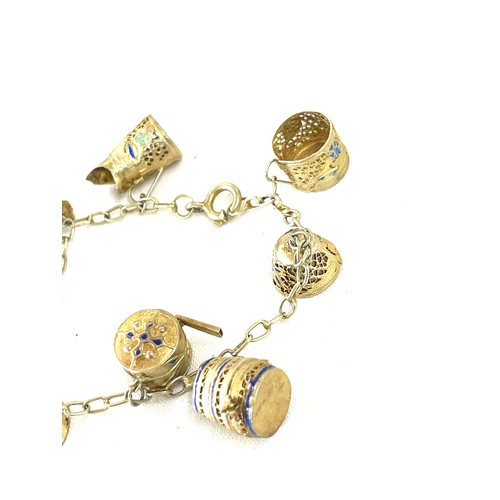 481 - Silver gilt and enamel charm bracelet, foreign mark to clasp, approximate weight 14g