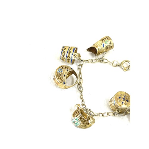 481 - Silver gilt and enamel charm bracelet, foreign mark to clasp, approximate weight 14g