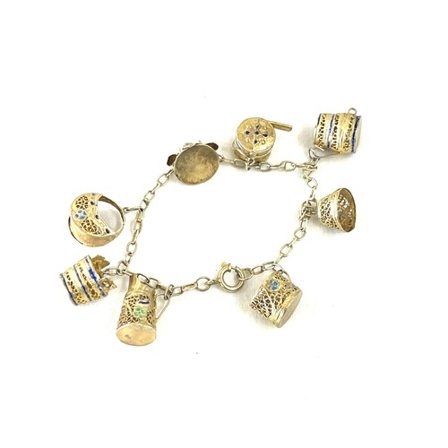 481 - Silver gilt and enamel charm bracelet, foreign mark to clasp, approximate weight 14g