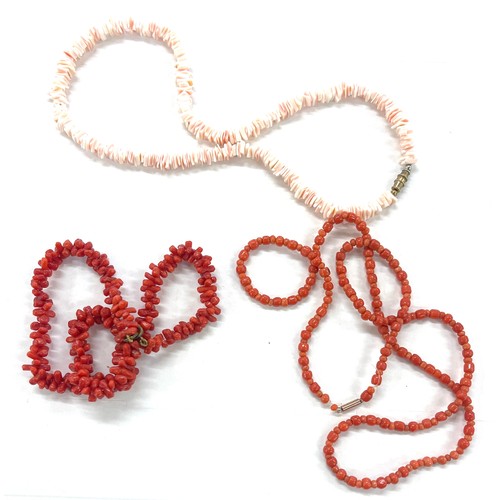 424 - 3 strings of coral beads, total approximate weight 61g, one has a 9ct gold clasp