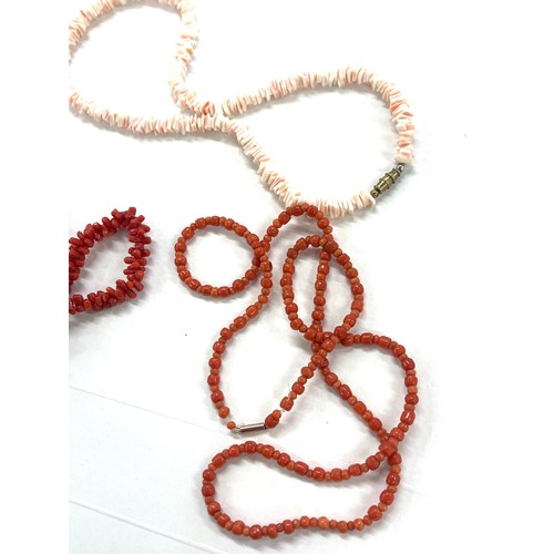 424 - 3 strings of coral beads, total approximate weight 61g, one has a 9ct gold clasp