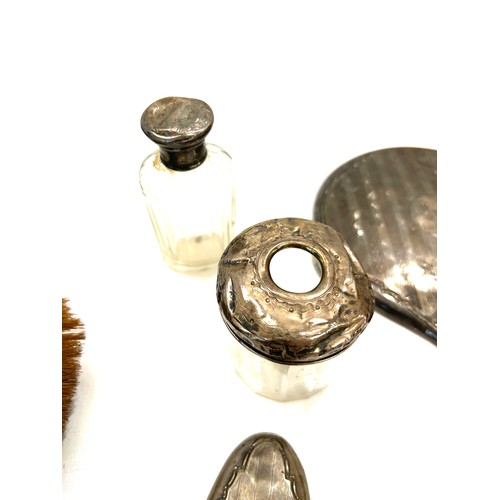 224 - Selection of silver pieces to include brushes, mirror, silver bottles etc