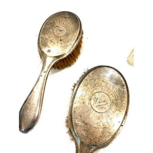 224 - Selection of silver pieces to include brushes, mirror, silver bottles etc