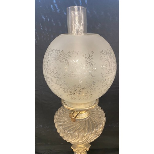 100C - Antique silver plated Nelson column oil lamp, glass shade and font, approximate height 27 inches