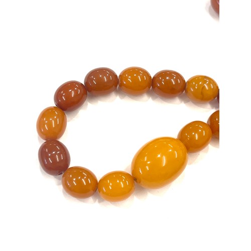 518 - Egg yolk amber bead necklace total weight 52.7g approx 30 inches long