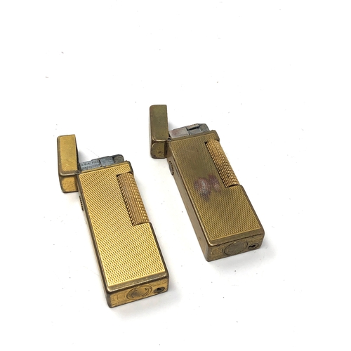 386 - 2 vintage dunhill cigarette lighters worn condition