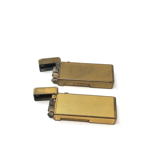 386 - 2 vintage dunhill cigarette lighters worn condition