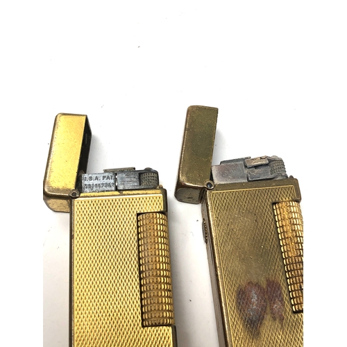 386 - 2 vintage dunhill cigarette lighters worn condition