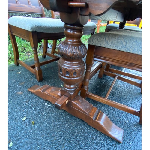 355 - Solid Oak gothic style table and 6 chairs has been repolished, (includes 2 carvers), chairs with uph... 