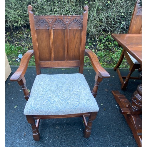 355 - Solid Oak gothic style table and 6 chairs has been repolished, (includes 2 carvers), chairs with uph... 