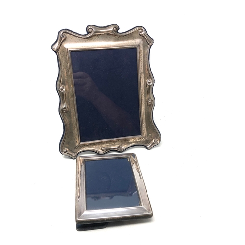 53 - 2 silver picture frames largest measures approx 24cm by 20cm m