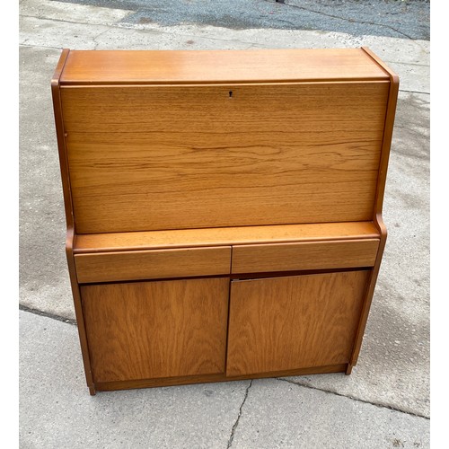 447 - Teak remploy bureau measures approx 42 inches tall 36 inches wide 16 inches depth