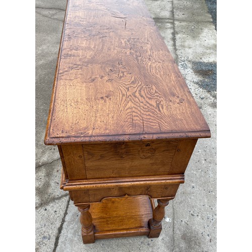 455 - Titchmarsh and Goodwin 3 drawer Burr oak sideboard with keys measures approximately 33.5 inches tall... 