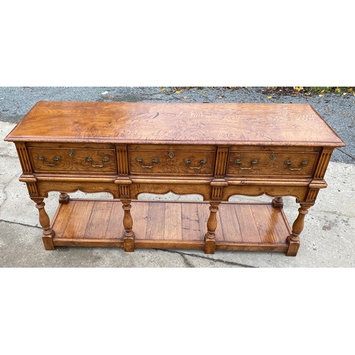 455 - Titchmarsh and Goodwin 3 drawer Burr oak sideboard with keys measures approximately 33.5 inches tall... 