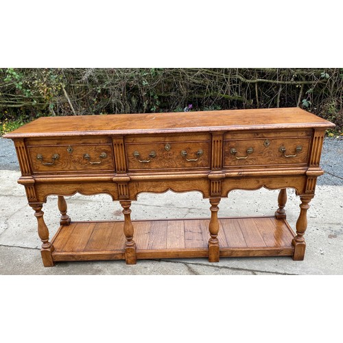 455 - Titchmarsh and Goodwin 3 drawer Burr oak sideboard with keys measures approximately 33.5 inches tall... 