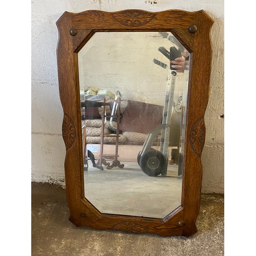 453 - Oak carved mirror measures approx 32 inches wide 20 inches tall