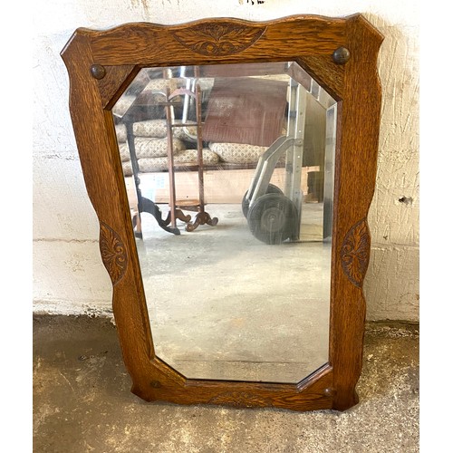 453 - Oak carved mirror measures approx 32 inches wide 20 inches tall