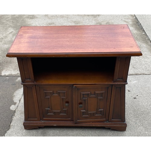 448 - Mahogany 2 door TV cabinet measures approx 29 inches tall 32 inches long 17 inches wide