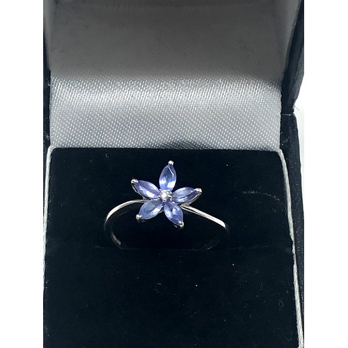 123 - 9ct white gold diamond & tanzanite floral ring (1.9g)