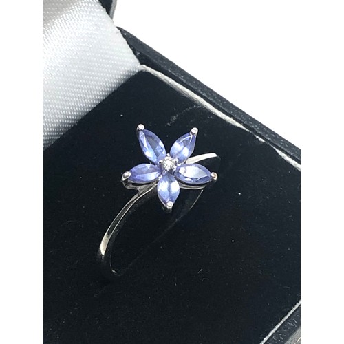 123 - 9ct white gold diamond & tanzanite floral ring (1.9g)