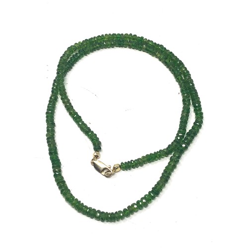 73 - 9ct gold clasp peridot necklace (11g)