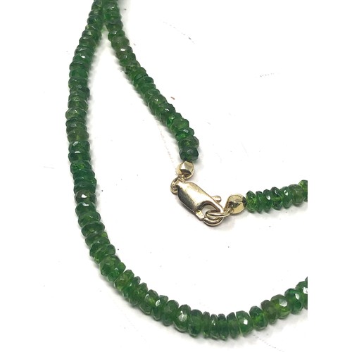 73 - 9ct gold clasp peridot necklace (11g)