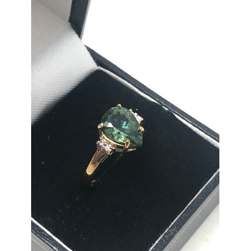 104 - 9ct gold diamond & tourmaline dress ring (2.2g)