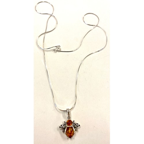 582 - Ladies hallmarked silver necklace with silver and amber bee pendant