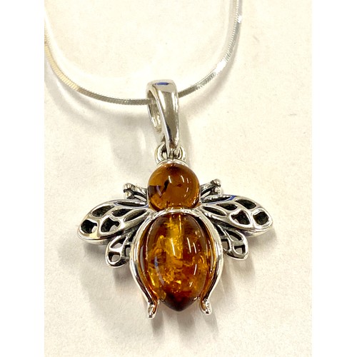 582 - Ladies hallmarked silver necklace with silver and amber bee pendant